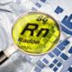 Magnifying glass showing the element Radon on the periodic table