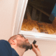Home inspector inspecting attic space - Inspection Works