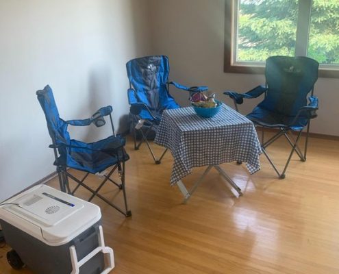 Table, chairs, snacks, and drinks set up by Inspection Works