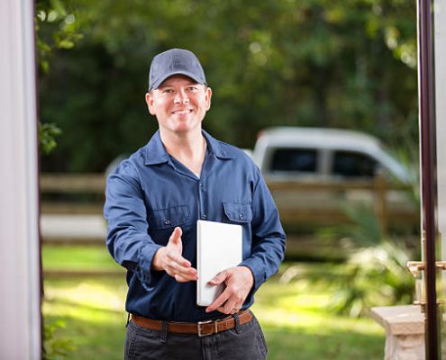 A photo of a home inspector greeting the homeowner.