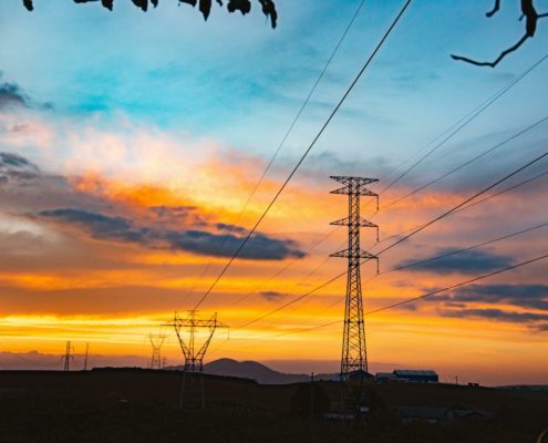 Power lines against a large sky sunset