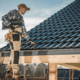 Worker inspecting a tiled roof.