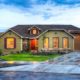 A landscaped yard with visible sloping to ensure water drainage away from the home.
